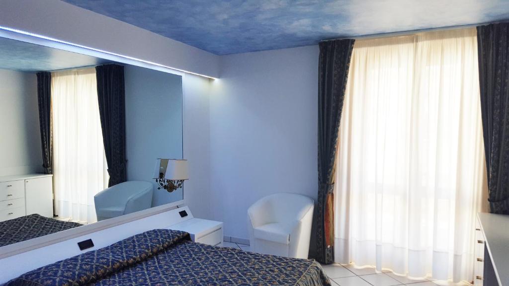 Postel nebo postele na pokoji v ubytování Hotel Ristorante Panoramico