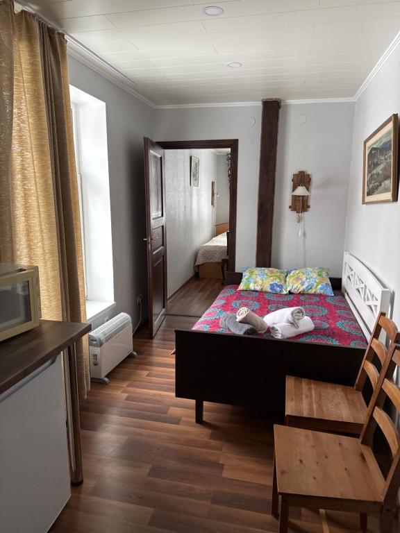 a bedroom with a bed with two people laying on it at Delta 6 two big beds in Tartu