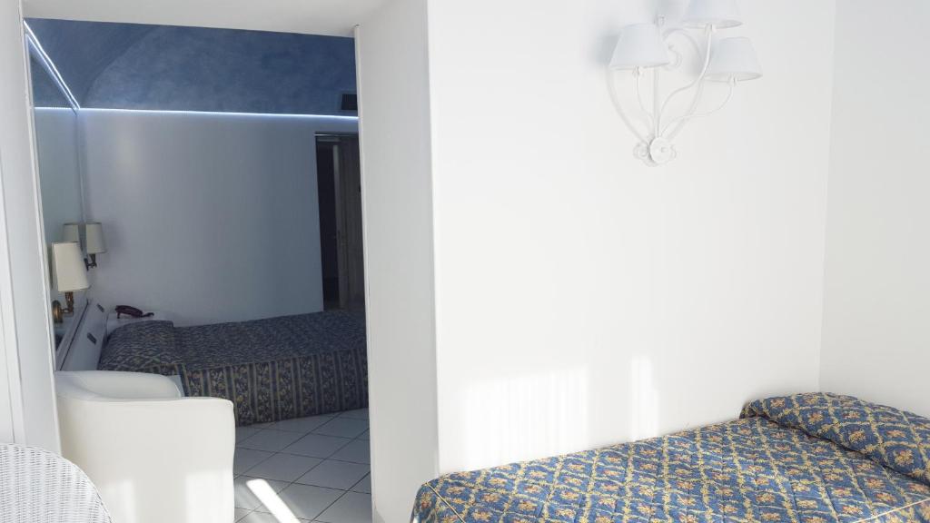 Postel nebo postele na pokoji v ubytování Hotel Ristorante Panoramico