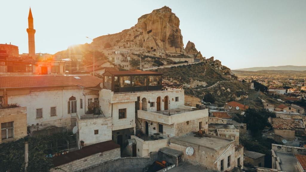 a view of a city with a mountain in the background at Tale Cave İnn in Ürgüp