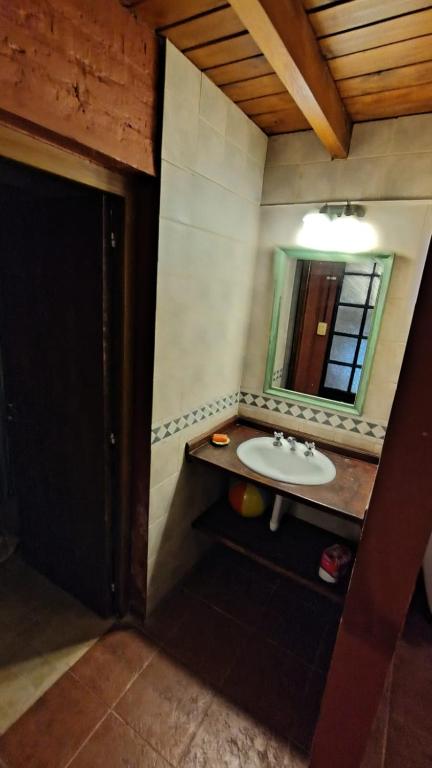 a bathroom with a sink and a mirror at margarita in Sauce Viejo