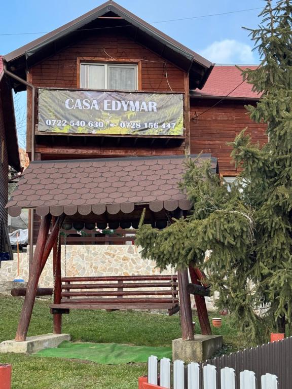 a building with a sign that reads casa levant at Casa Edimar in Sboghiţeşti