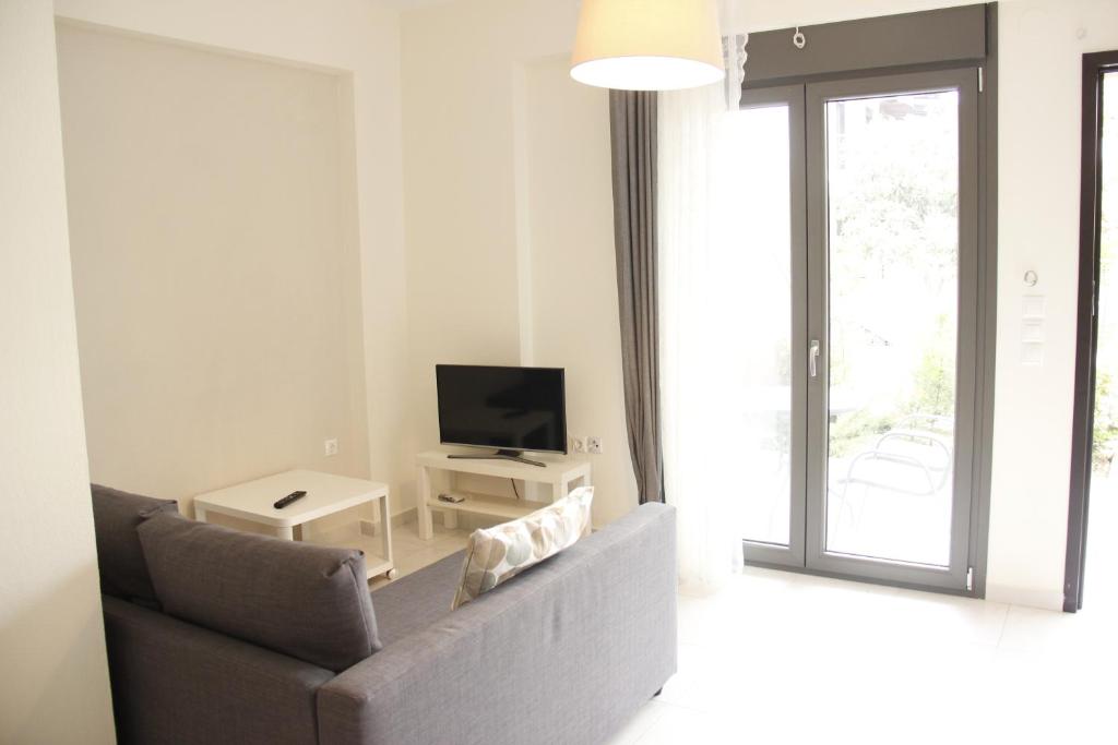 Telewizja i/lub zestaw kina domowego w obiekcie Polychrono Apartments