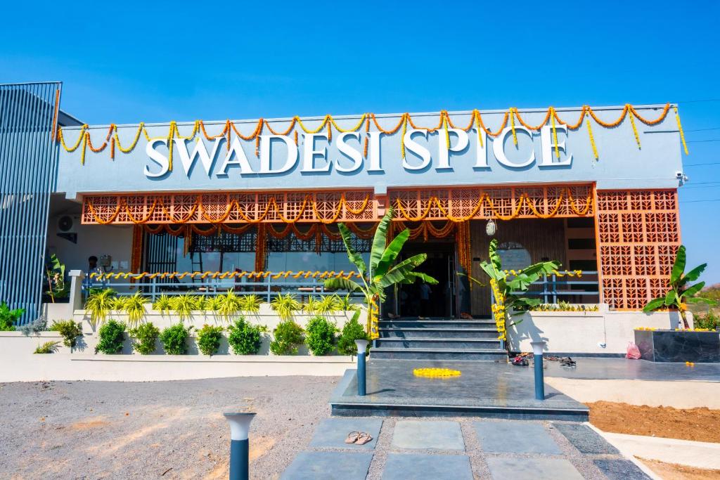 a building with a sign that reads wandest spice at Vihari Foodway Inn in Jāmb