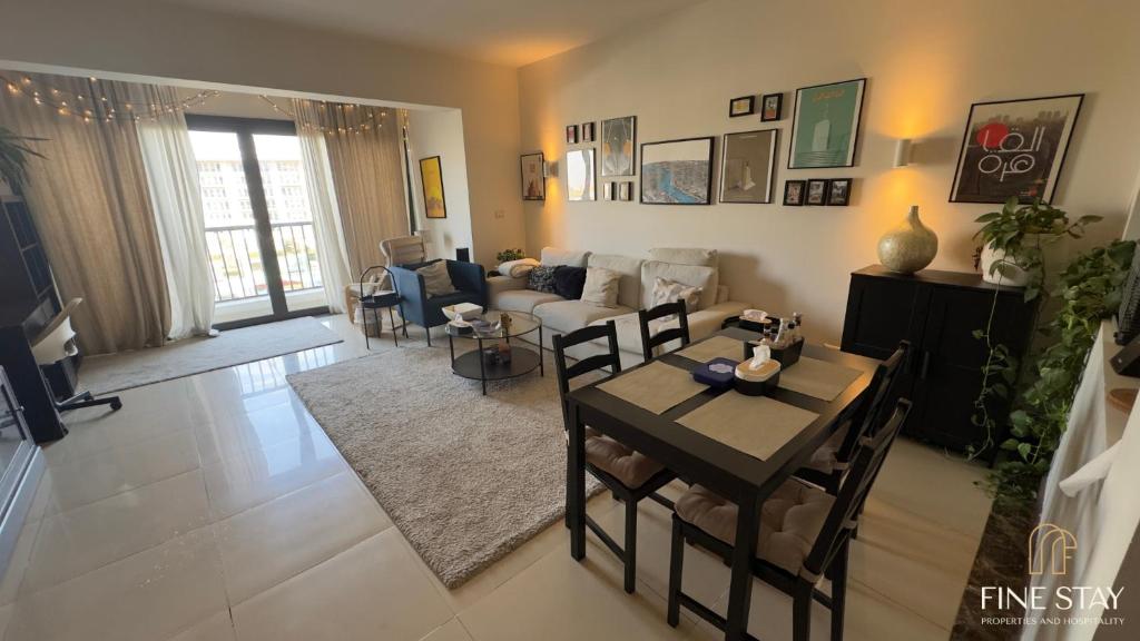 a living room with a couch and a table at Modern 2BR Duplex in New Cairo Quiet Area, Balcony & Fast WiFi in Cairo