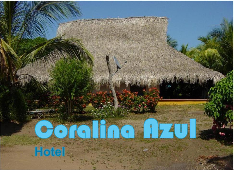 a resort with a clock in front of a building at La Coralina azul in San Bernardo del Viento