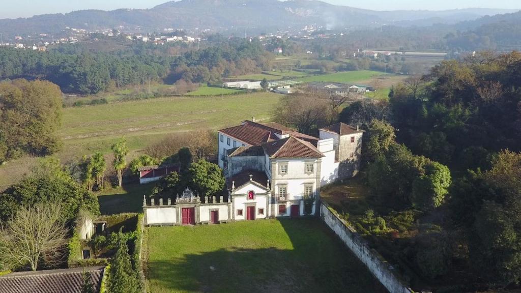 an aerial view of a house on a green field at Casa de Nossa Senhora da Piedade in Ponte de Lima