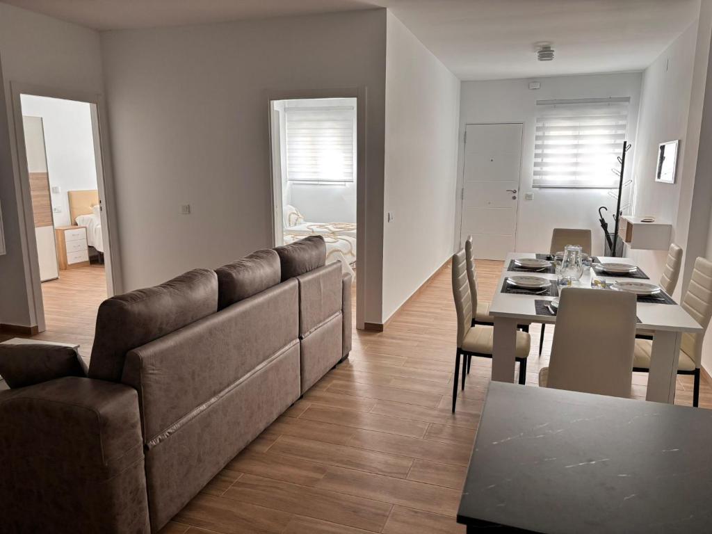 a living room with a couch and a table at Apartamento Maruchi in Santa Cruz de Mudela
