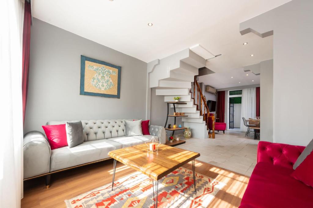 a living room with a couch and a table at Bright Apart Hotel in Istanbul