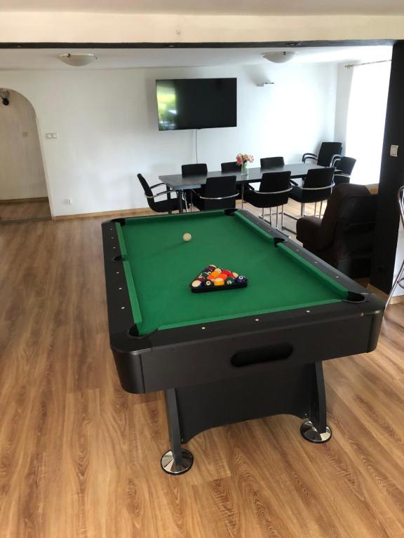 a pool table sitting in a room with a pool table at Żurawie Wzgórze in Mrągowo