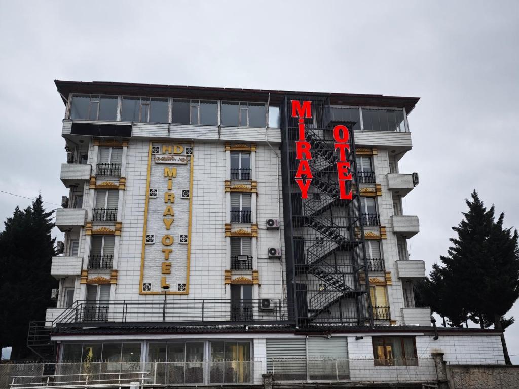a building with a sign on the side of it at HD Miray Otel in Tosya