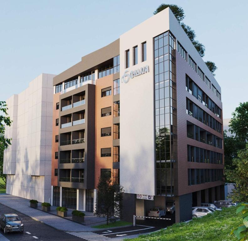 a building with a sign on the side of it at Skyline Residence Podgorica in Podgorica
