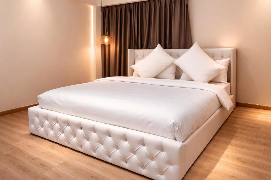 Llit o llits en una habitació de RARA HM Suites