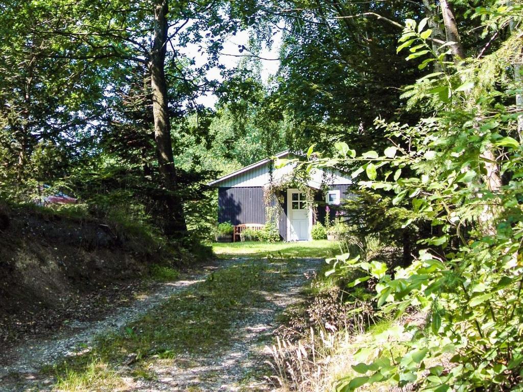a small house in the middle of a dirt road at 4 person holiday home in Aars-By Traum in Års