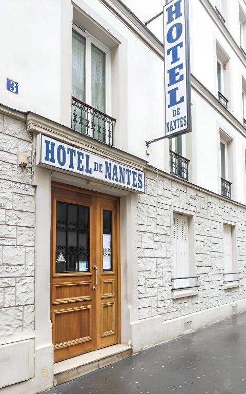 a hotel sign on the front of a building at Hotel de Nantes in Paris