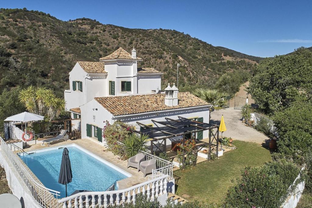 an aerial view of a house with a swimming pool at Casa Brisa Do Rio, Malhada do São - Rural in Tavira
