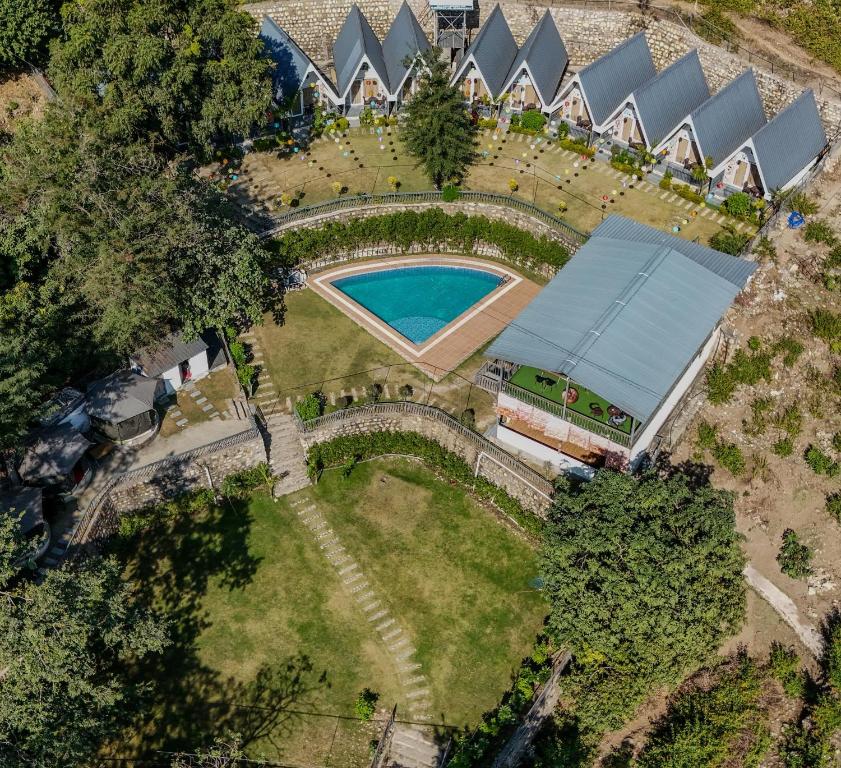 an overhead view of a yard with a swimming pool at The Jungle Walker Resort in Rishīkesh