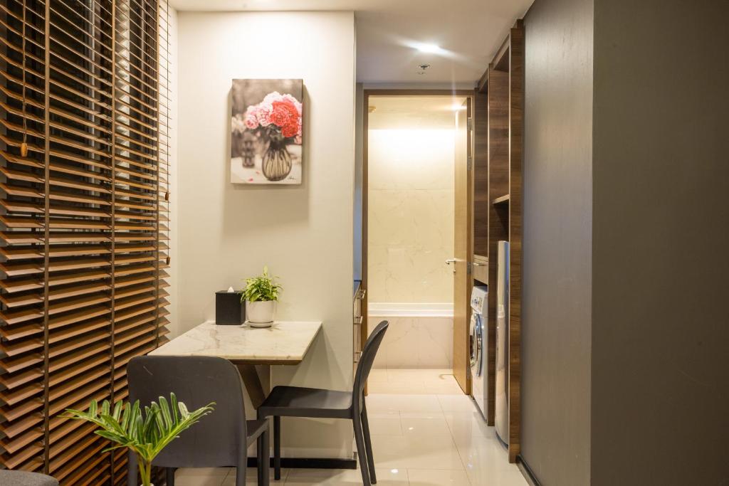 A small dining and work corner beside the bathroom entrance.