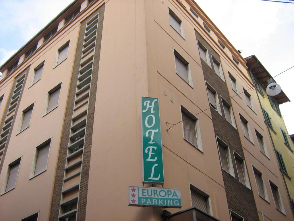a building with a sign on the side of it at Hotel Europa Parking in Livorno