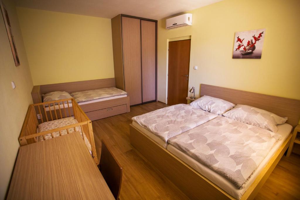 Postel nebo postele na pokoji v ubytování Vendelin Apartmany