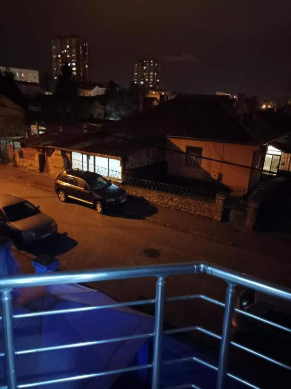 a car parked in a parking lot at night at Blue point in Kragujevac