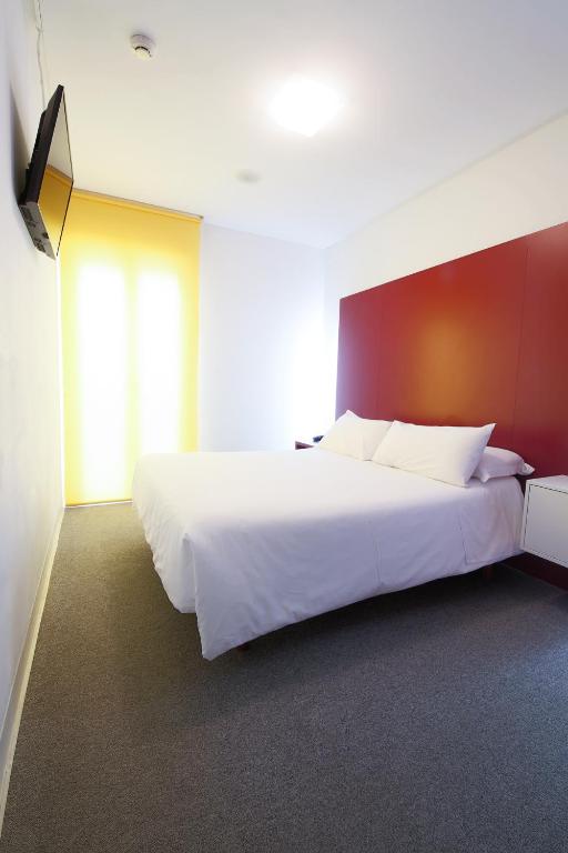 Posteľ alebo postele v izbe v ubytovaní Hostal Albany