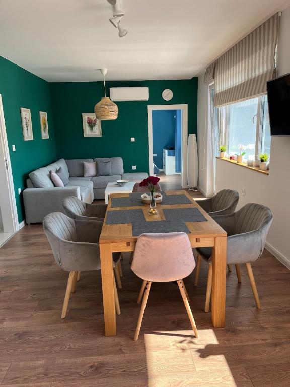 a living room with a table and a couch at Green view 180 in Troyan