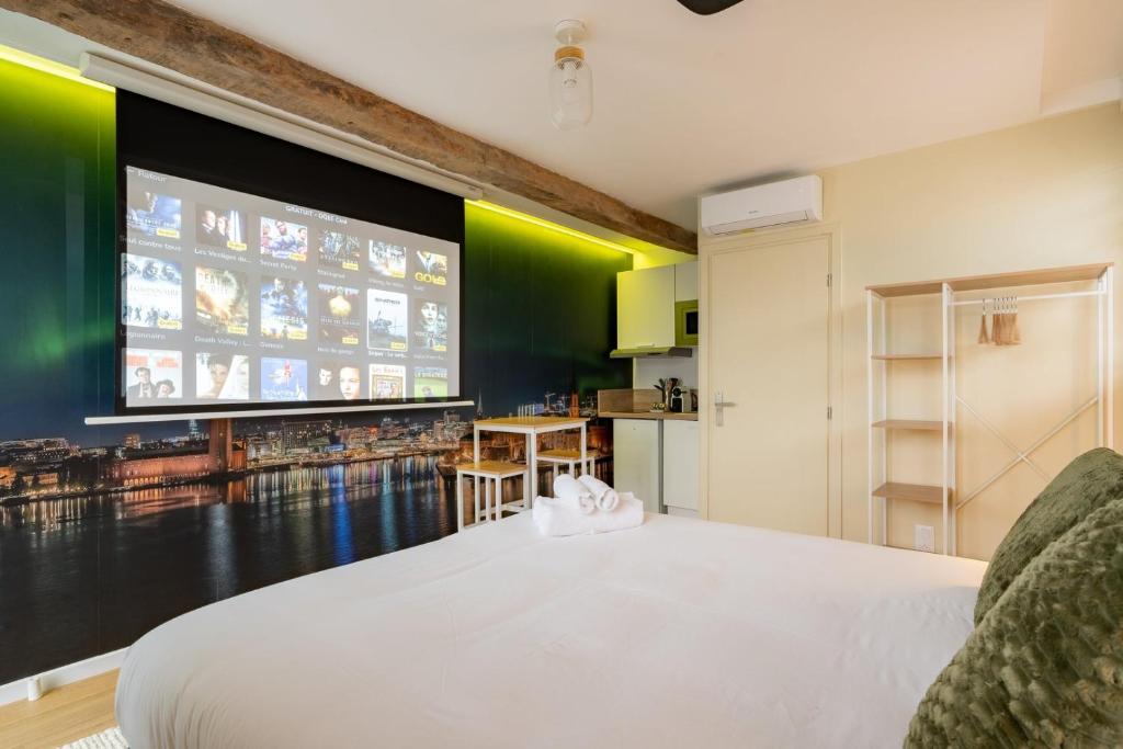 a bedroom with a large window and a large bed at Air Nomad • Stockholm in Valenciennes