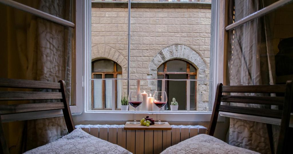 a window with a candle and a table in a room at Florence Tower Apartment in Florence
