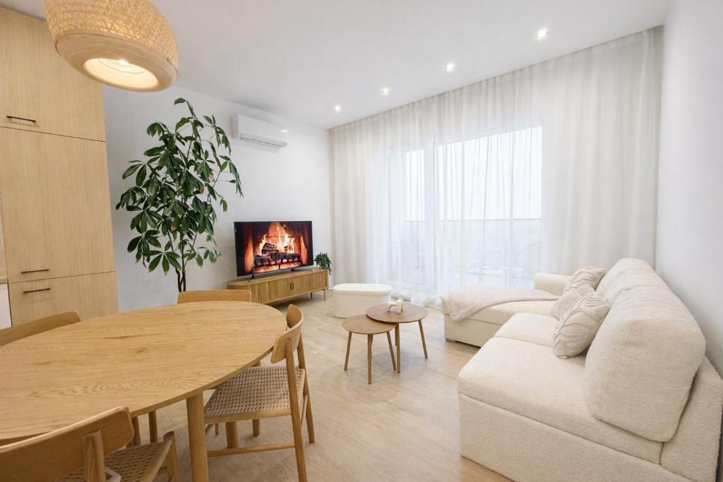 a living room with a table and a couch at BONA Apartment in Świecie