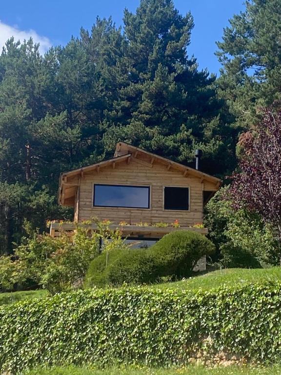 a tiny house in the middle of a garden at La Torre d' Espinalbet in Castellar del Riu