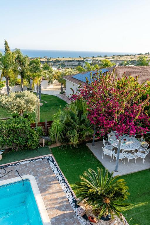 an aerial view of a yard with a swimming pool at ROSE VILLA - 3 BED POOL in Episkopi Limassol