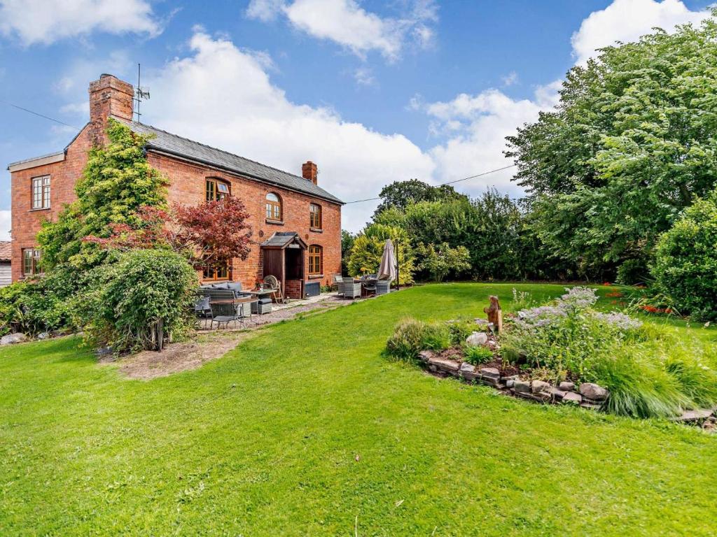 an exterior view of a brick house with a yard at 4 Bed in Hereford oc-44213 in Hereford