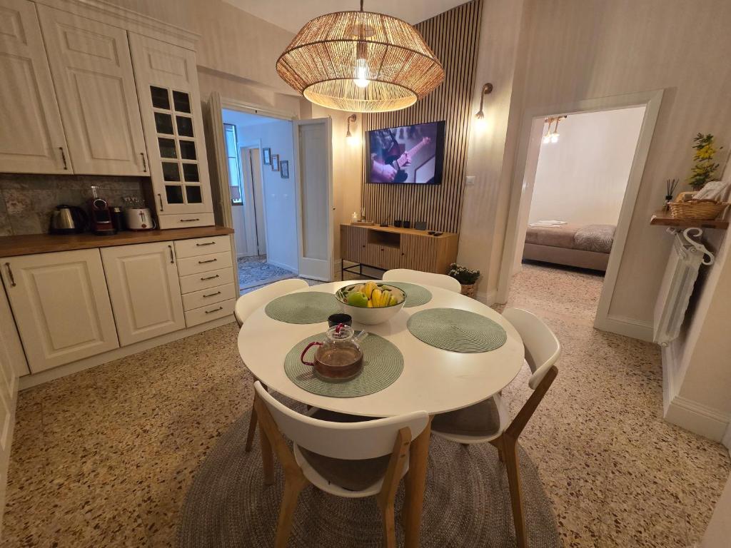 a kitchen with a table with a bowl of fruit on it at Casa Larissa in Rufina
