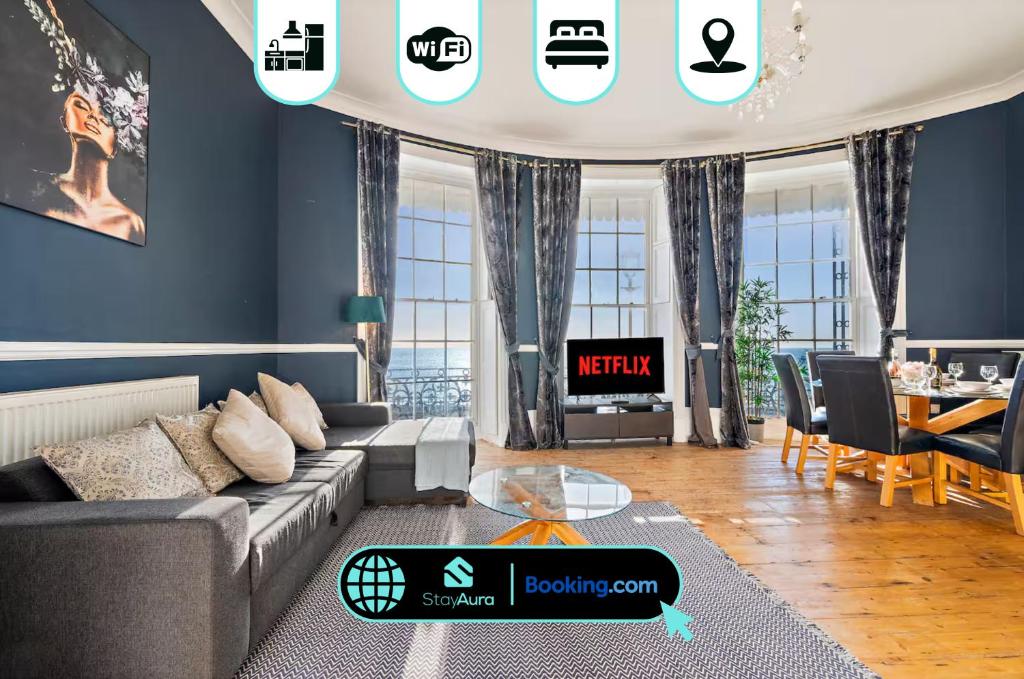 a living room with a couch and a table at Premium Beach Front with Balcony! 2 En-Suites & Spacious By Stay Aura Vacation Rental Brighton & Hove in Brighton & Hove