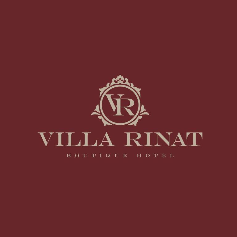 a logo for a hotel with a letter r and a crown at Villa Rinat in Kyiv