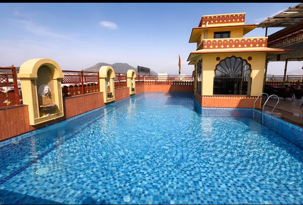 a large swimming pool on top of a building at Umaid Residency - A Regal Heritage Home in Jaipur