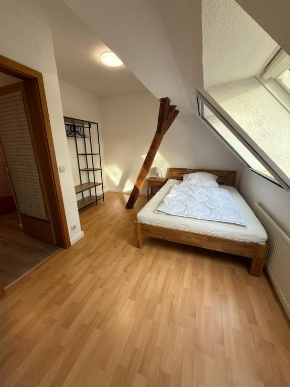 a bedroom with a bed in a attic at Ferienwohnung Meyer in Neuenkirchen