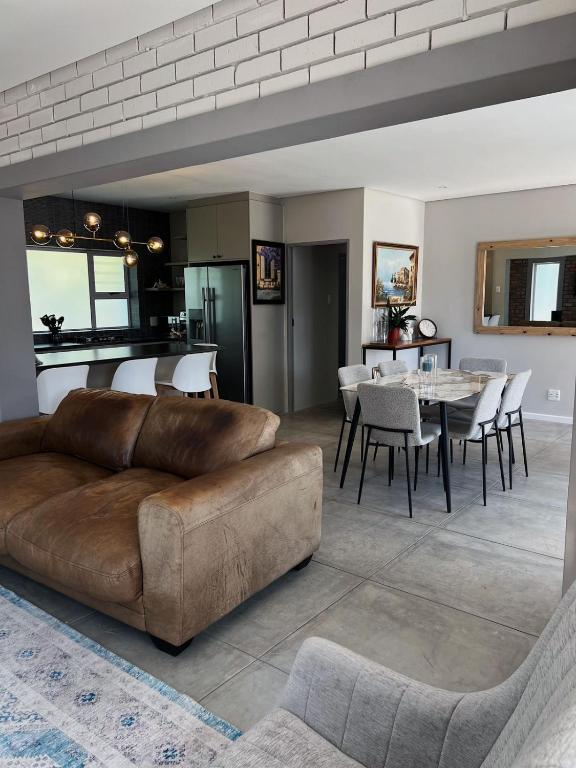 a living room with a couch and a table at Villa Bella in George