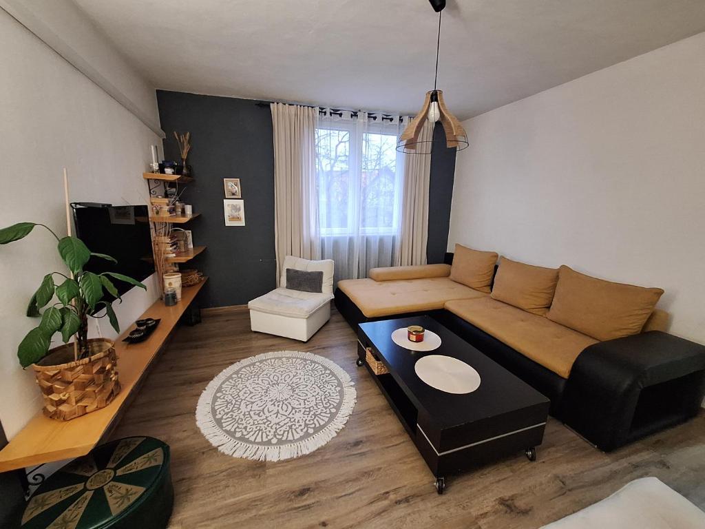 a living room with a couch and a table at VP in Bajina Bašta
