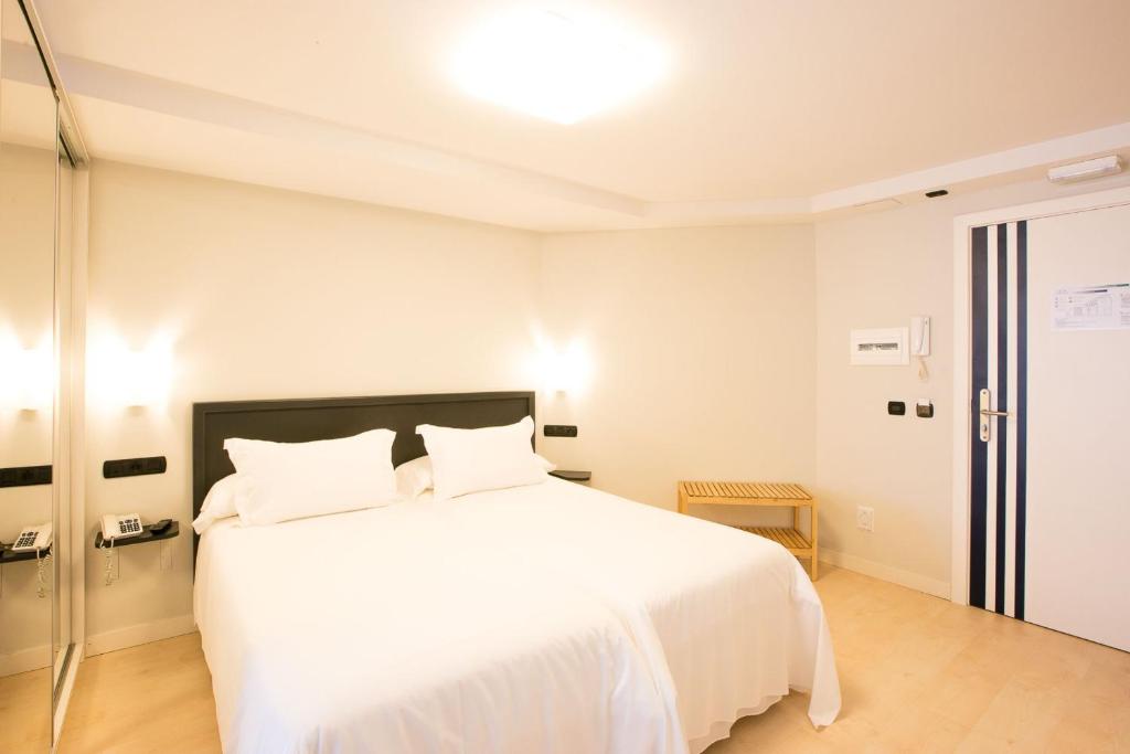 Postel nebo postele na pokoji v ubytování Apartamentos Mundaka