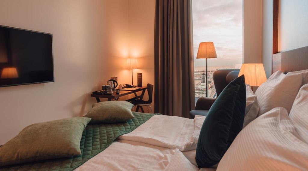 Postel nebo postele na pokoji v ubytování Clarion Hotel Helsinki