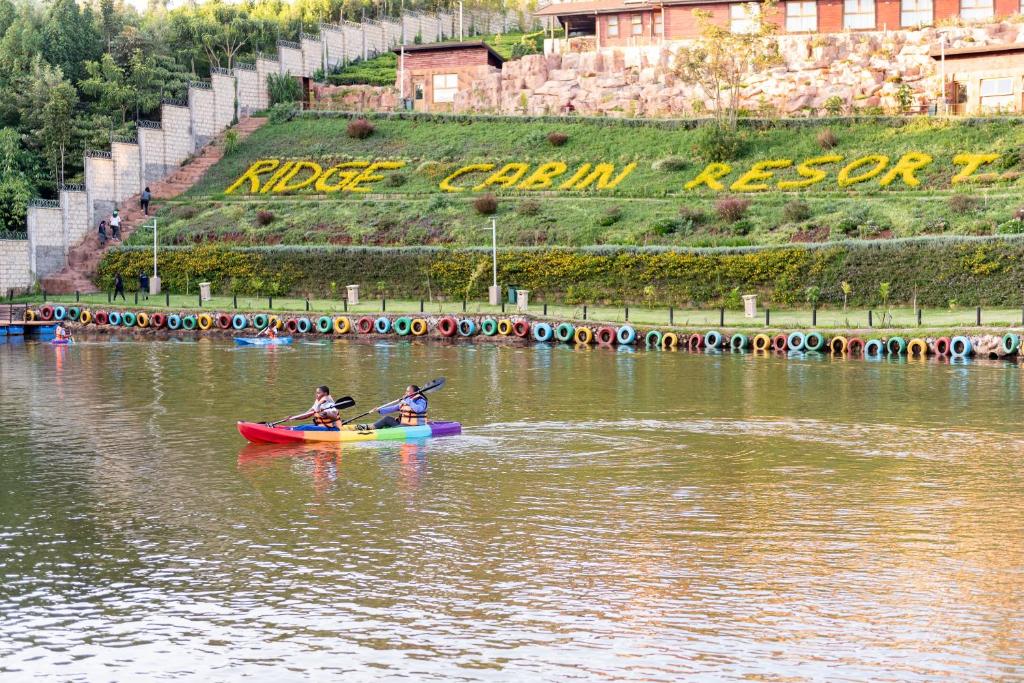 two people are in a kayak on a river at Ridge Cabin Resort in Nairobi
