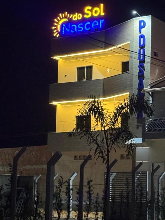 a building with a sign on the side of it at Pousada nascer do sol in Portalegre