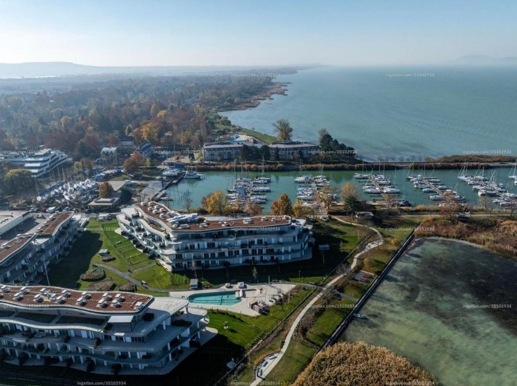 an aerial view of a marina with boats in the water at Szemesbay luxus apartman in Balatonszemes