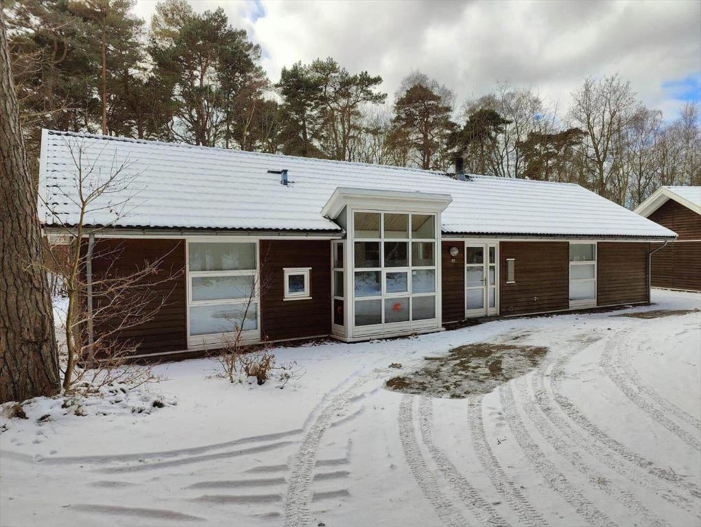 a house with a snow covered driveway in front of it at 6846-Hasle-Rubinvej-2-Hus-17 in Hasle