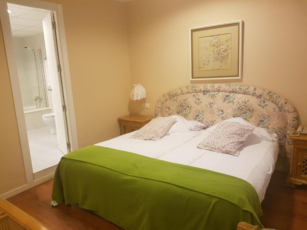 Postel nebo postele na pokoji v ubytování Hotel del Carme