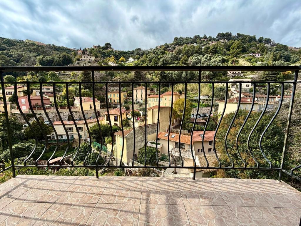 a view of a city from a balcony at Maison Azurélienne in Menton