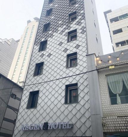 a tall building with windows on the side of it at Regen Hotel in Seoul