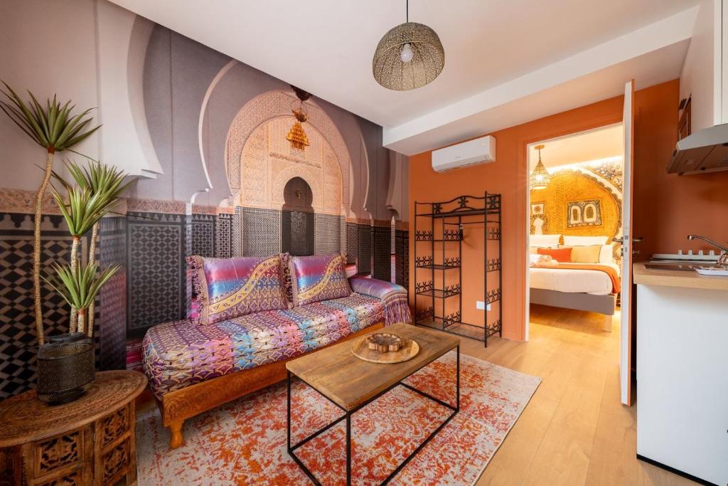 a living room with a couch and a table at Air Nomad • Marrakech in Valenciennes